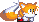 Sprite of Tails crouching.