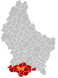 D'Gemeng Monnerech (orange) am Kanton Esch-Uelzecht (rout)