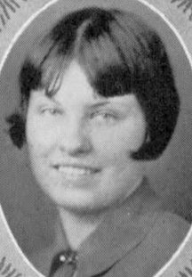 A young white woman with cropped straight dark hair with bangs, from a 1928 yearbook