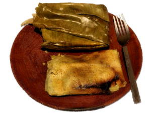 tamales on a wooden plate
