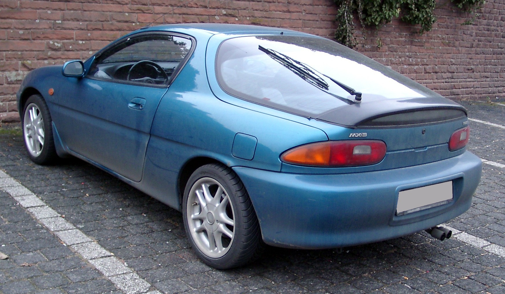 http://upload.wikimedia.org/wikipedia/commons/0/0a/Mazda_MX-3_rear_20080103.jpg