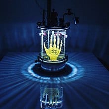 "REGENERATIVE RELIQUARY" by Amy Karle, 2016 is a Hybrid Art / Bioart sculpture of hand design that was 3D printed / bioprinted on the microscopic level in trabecular structure out of pegda hydrogel to create scaffold for human MSC stem cell culture into bone
