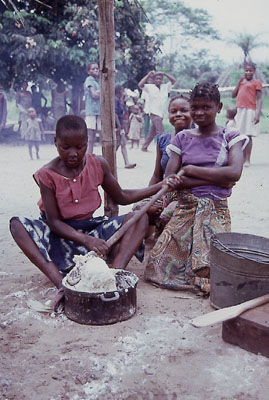 Young women in preparing manioc bread or Fufu....
