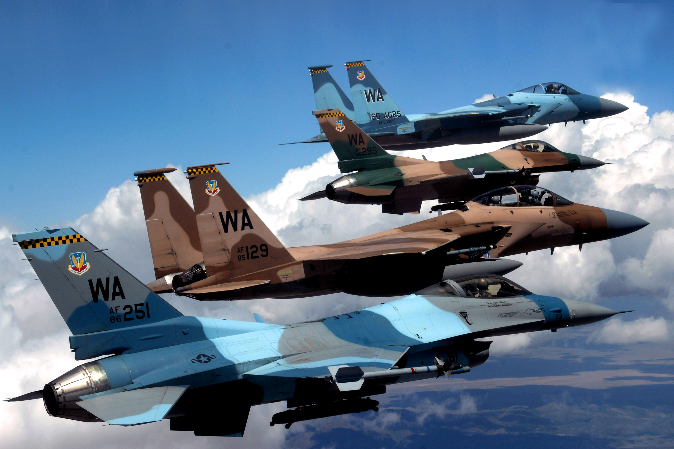 F-15 and F-16 belonging to 64 and 65 Aggressor Squadron