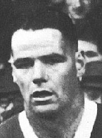 Black and white photograph of a man with his mouth open