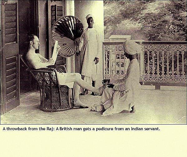 A British man gets a pedicure from an Indian servant
