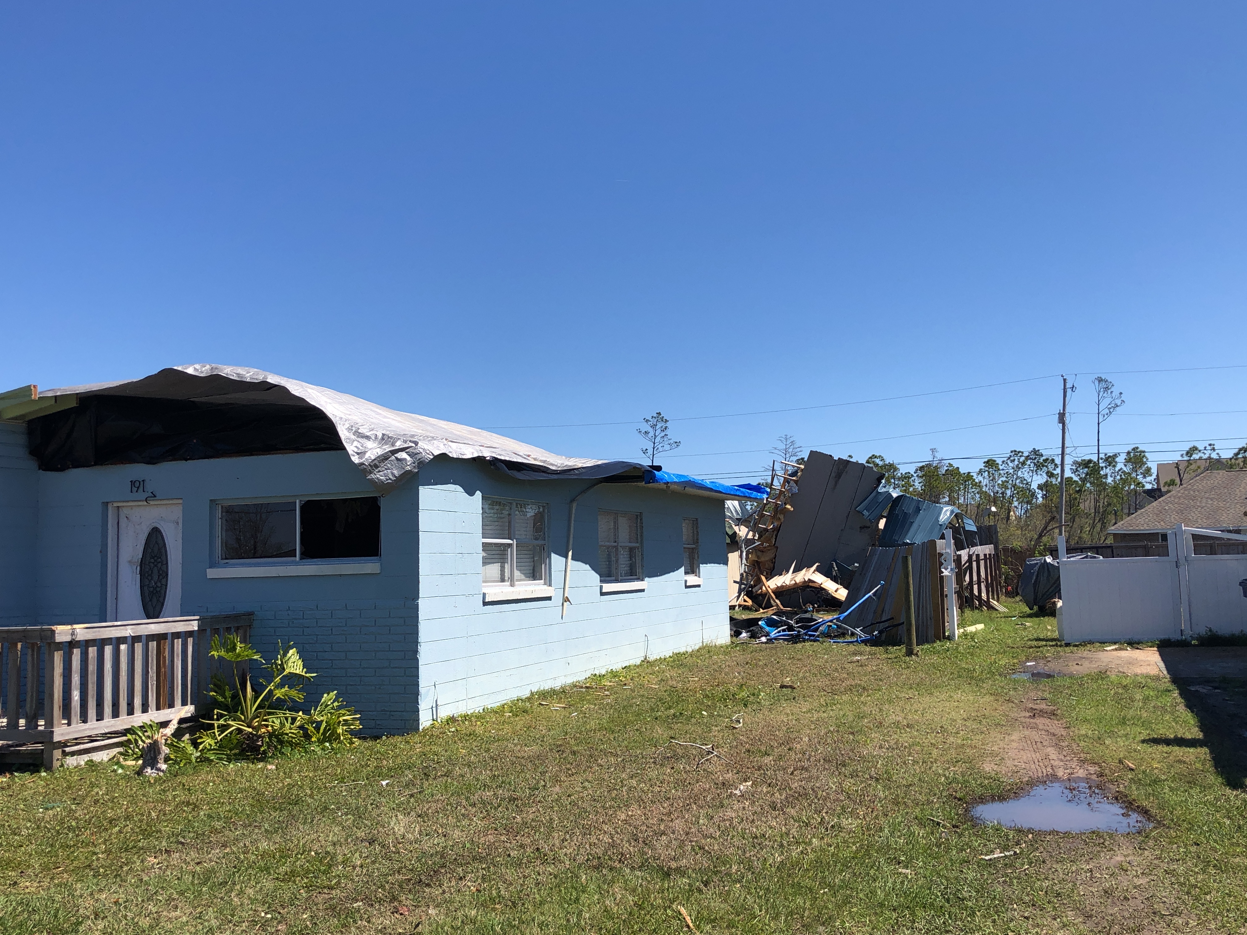 A home that had its roof torn off by an EF2 tornado in Panama City, Florida.
