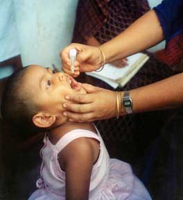 Child receiving polio vaccine.