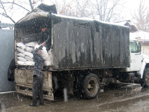 Supplies are unloaded from a truck in Tajikistan during the harsh 2007-2008 winter Tajikistan 2008 Winter 1.jpg