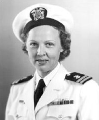 A young white woman in a white Navy uniform, with cap and necktie.