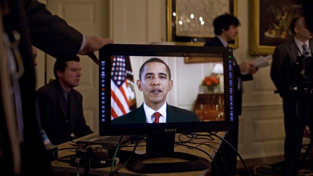President Obama on a video screen
