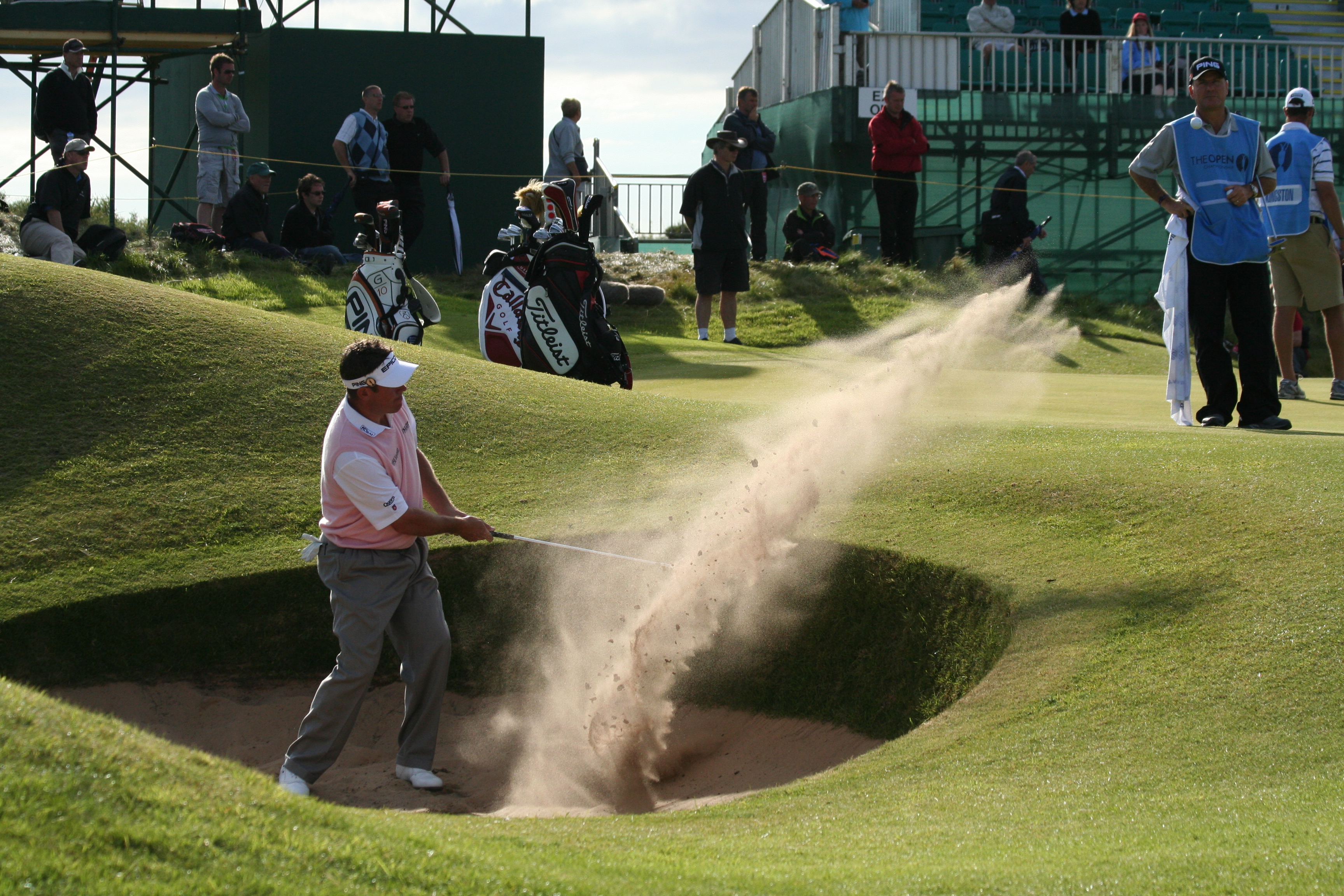 English: Lee Westwood makes a bunker shot at t...