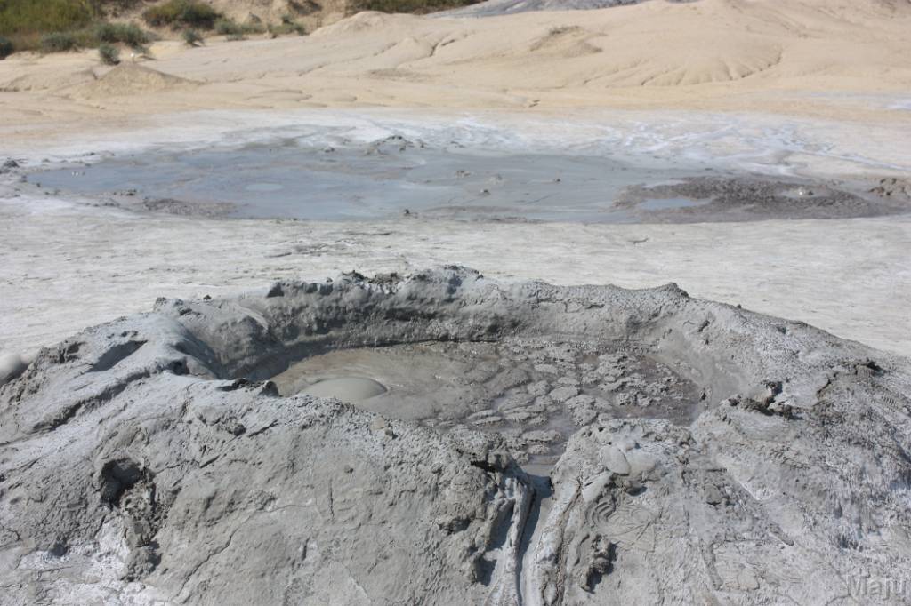 http://upload.wikimedia.org/wikipedia/commons/2/2d/Mud_volcano_Romania_1.jpg