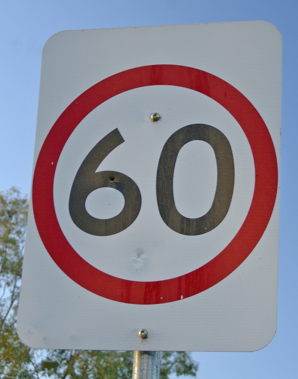 A typical 60 km/h speed limit sign used in Australia