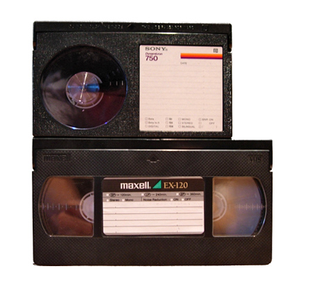 Size comparison between a Betamax cassette (top) and a VHS cassette (bottom).