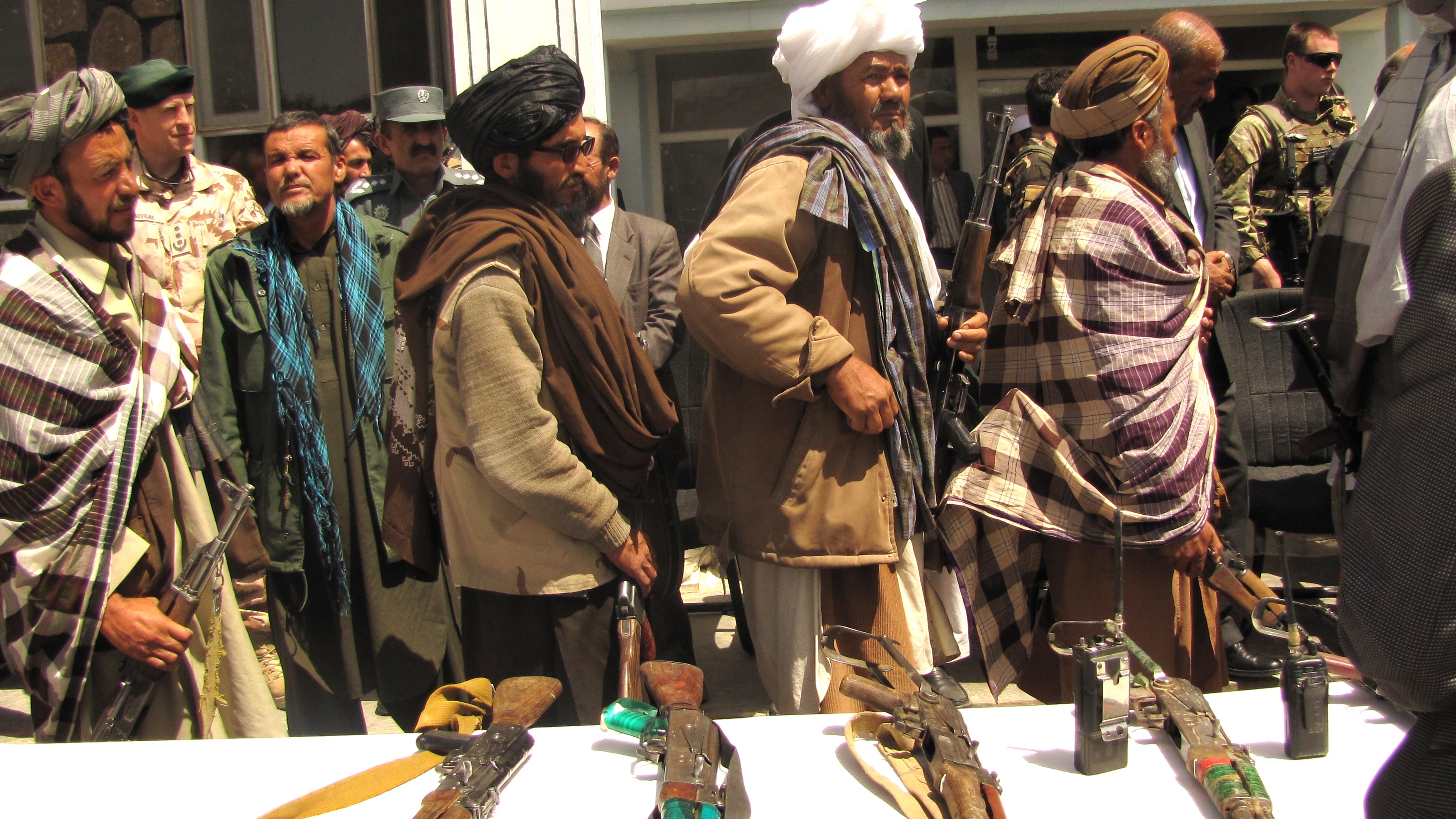 Taliban fighters surrender their arms, Afghanistan 