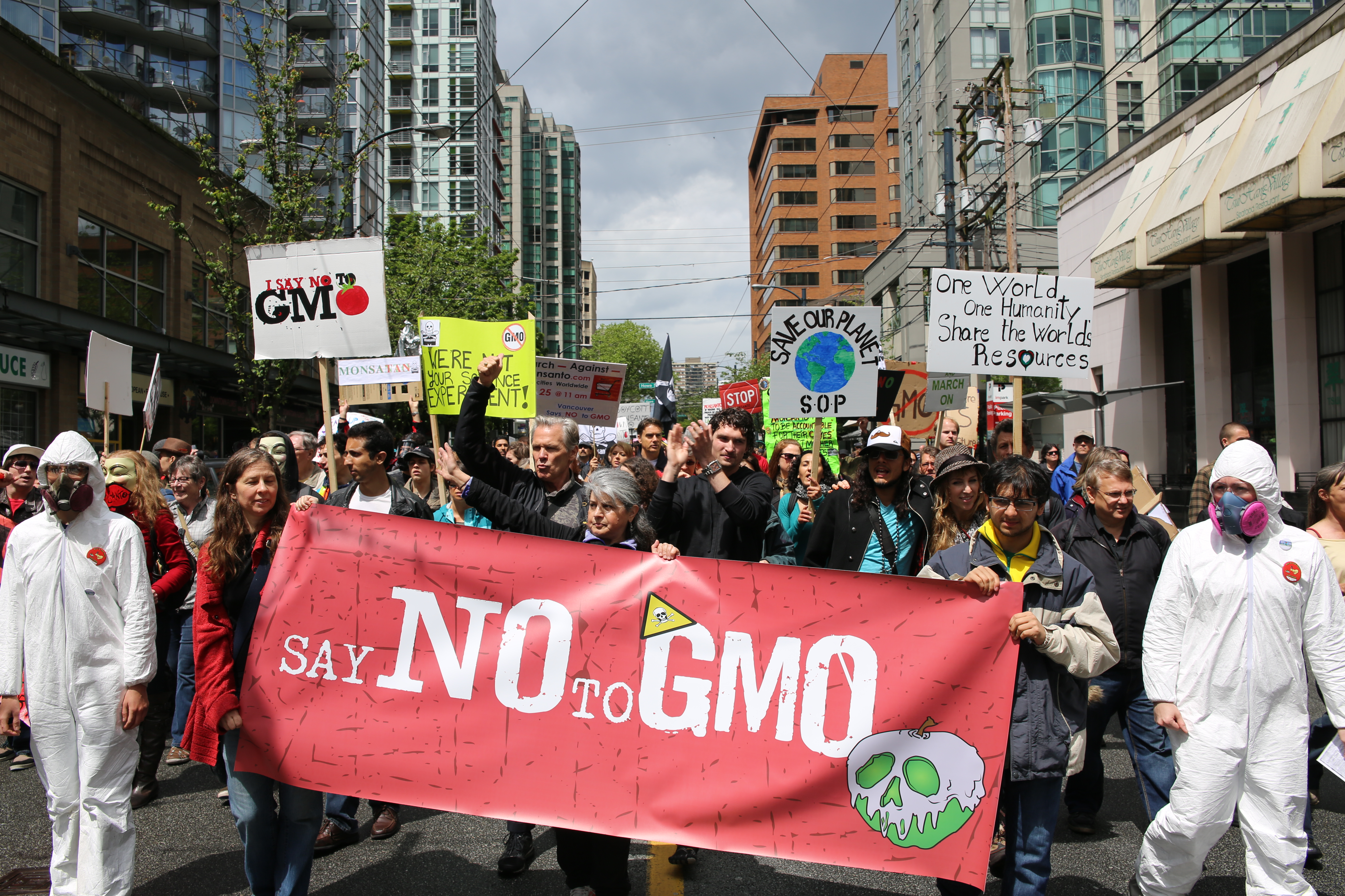 Individuals protesting the use of GMOs or Genetically Modified Organisms