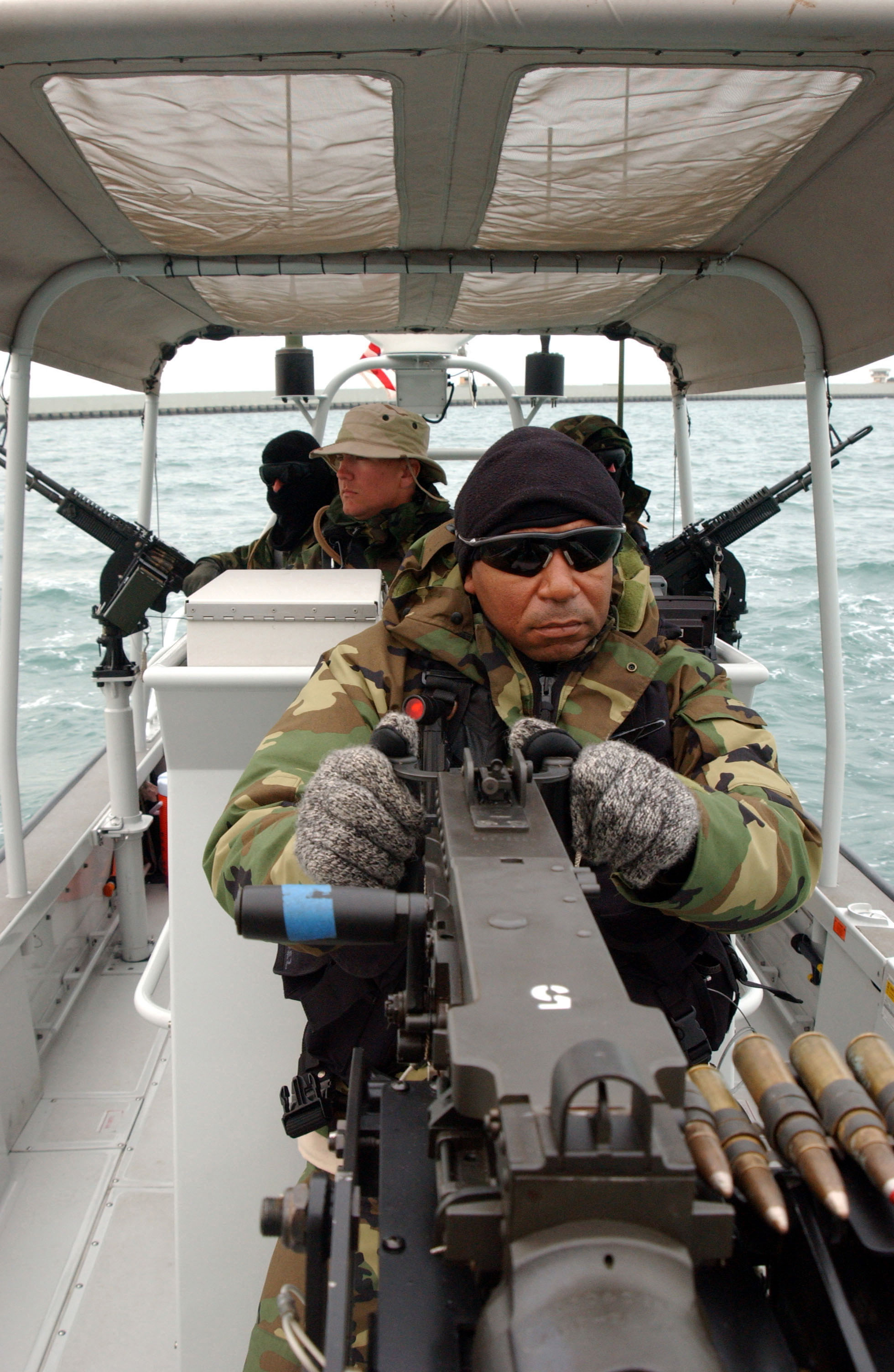File:US Navy 040222-N-0401E-026 Crewmembers aboard a patrol craft assigned to Coast ...
