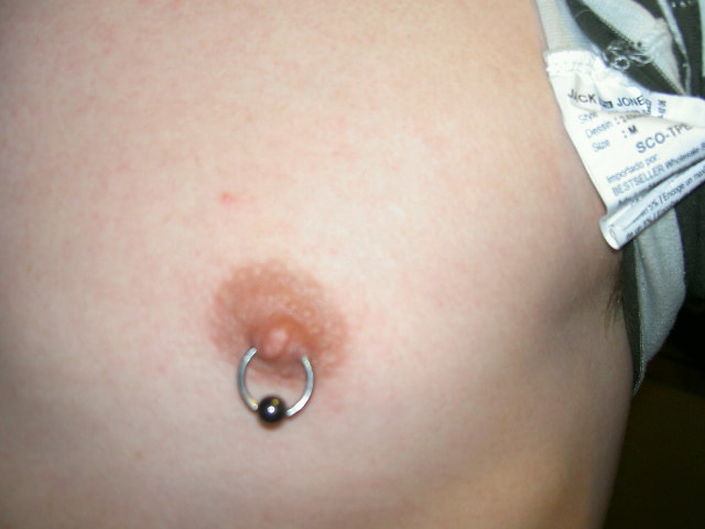 Nipple piercing is popular by both women and men. It, goes through the base 