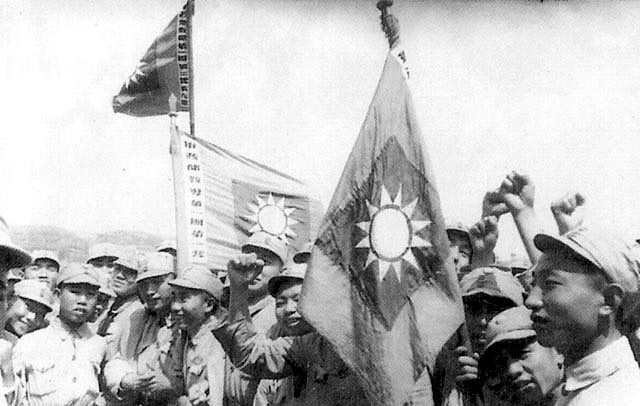 http://upload.wikimedia.org/wikipedia/commons/6/6b/NRA_soldiers_with_flags.jpg