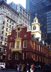 The 18th-century Old State House in Boston is surrounded by tall buildings of the 19th and 20th centuries.