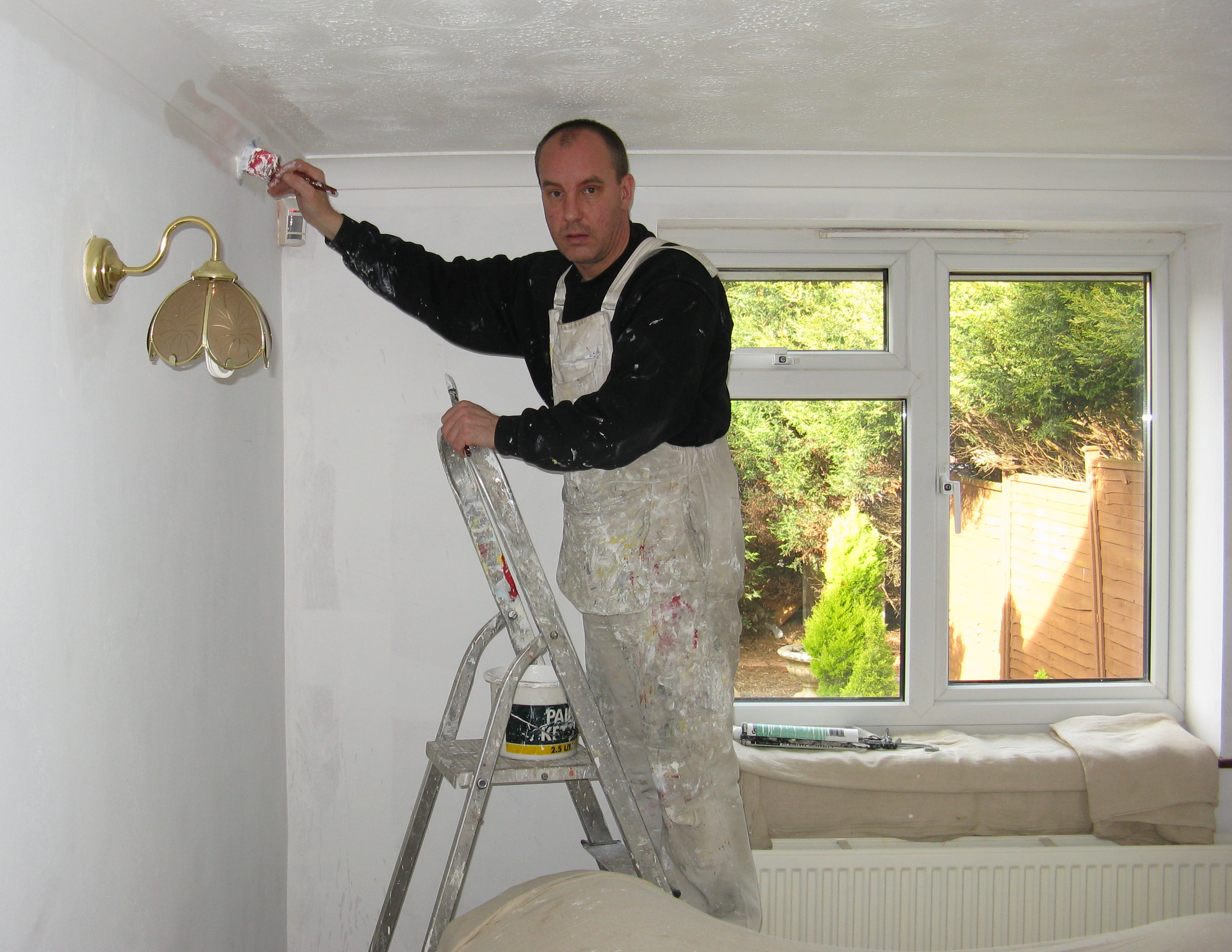 Painter Painting a Room