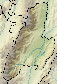 Mapa konturowa Tolima, u góry znajduje się czarny trójkącik z opisem „Nevado de Quindio”