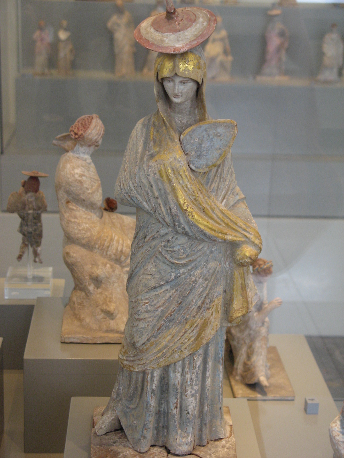 http://upload.wikimedia.org/wikipedia/commons/7/7e/Altes_Museum-Tanagra-lady_with_fan.jpg