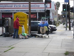English: Dumpster diving in Highland Park, a n...