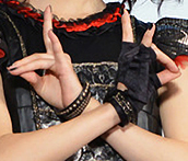 Yuimetal, former member of Babymetal, showing the kitsune sign, 2015
