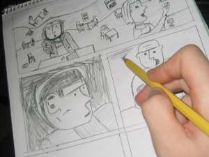 An artist sketching a comics page