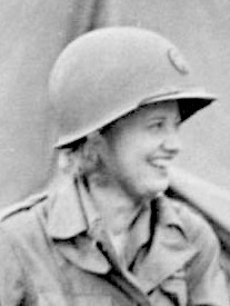 Ruth Cowan Nash smiling, face turned to the left, wearing an Army helmet