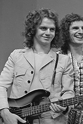 Slade - TopPop 1973 19 - Jim Lea - Crop.png