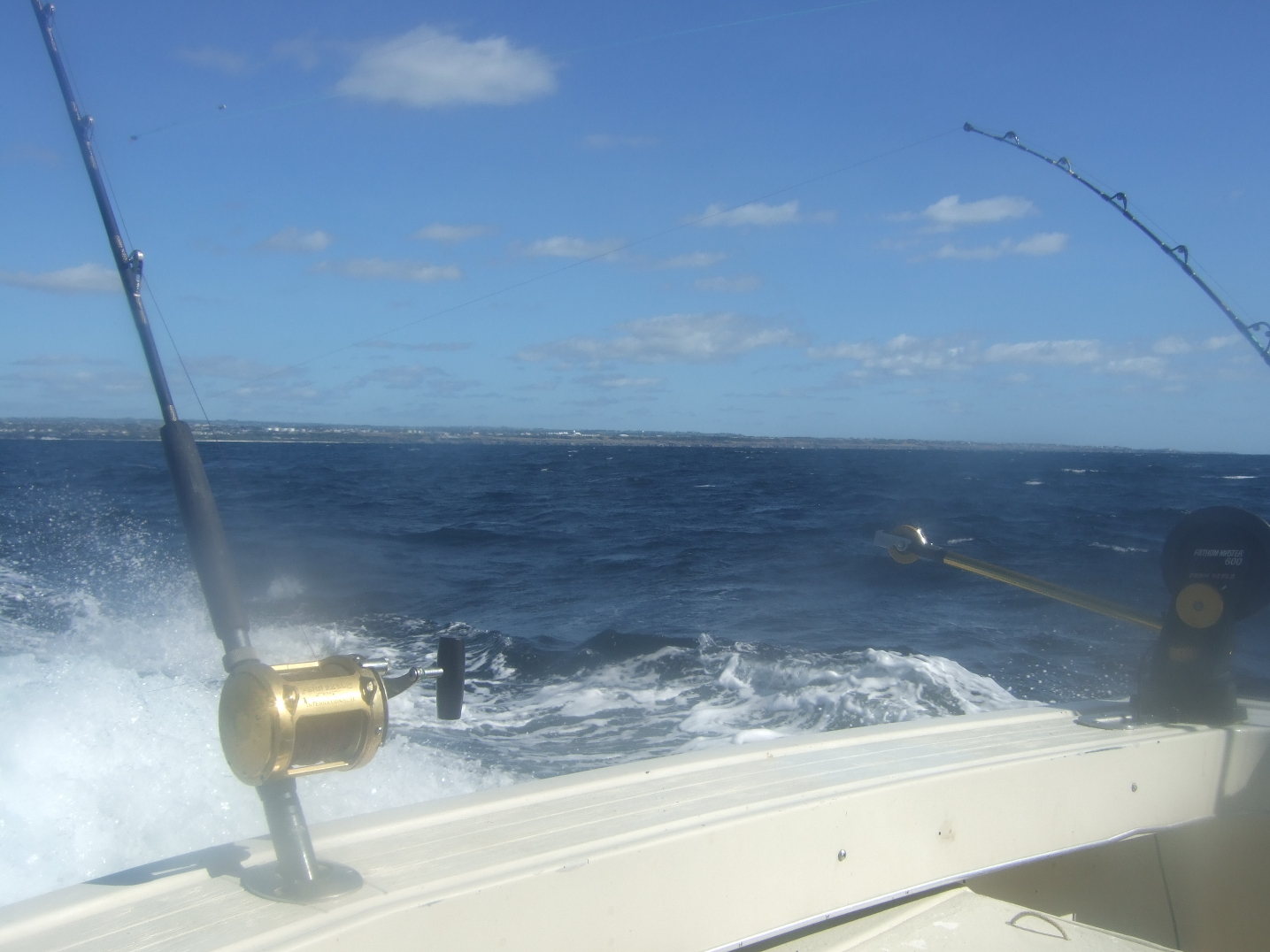Description Charter boat rod fishing off the airport.JPG