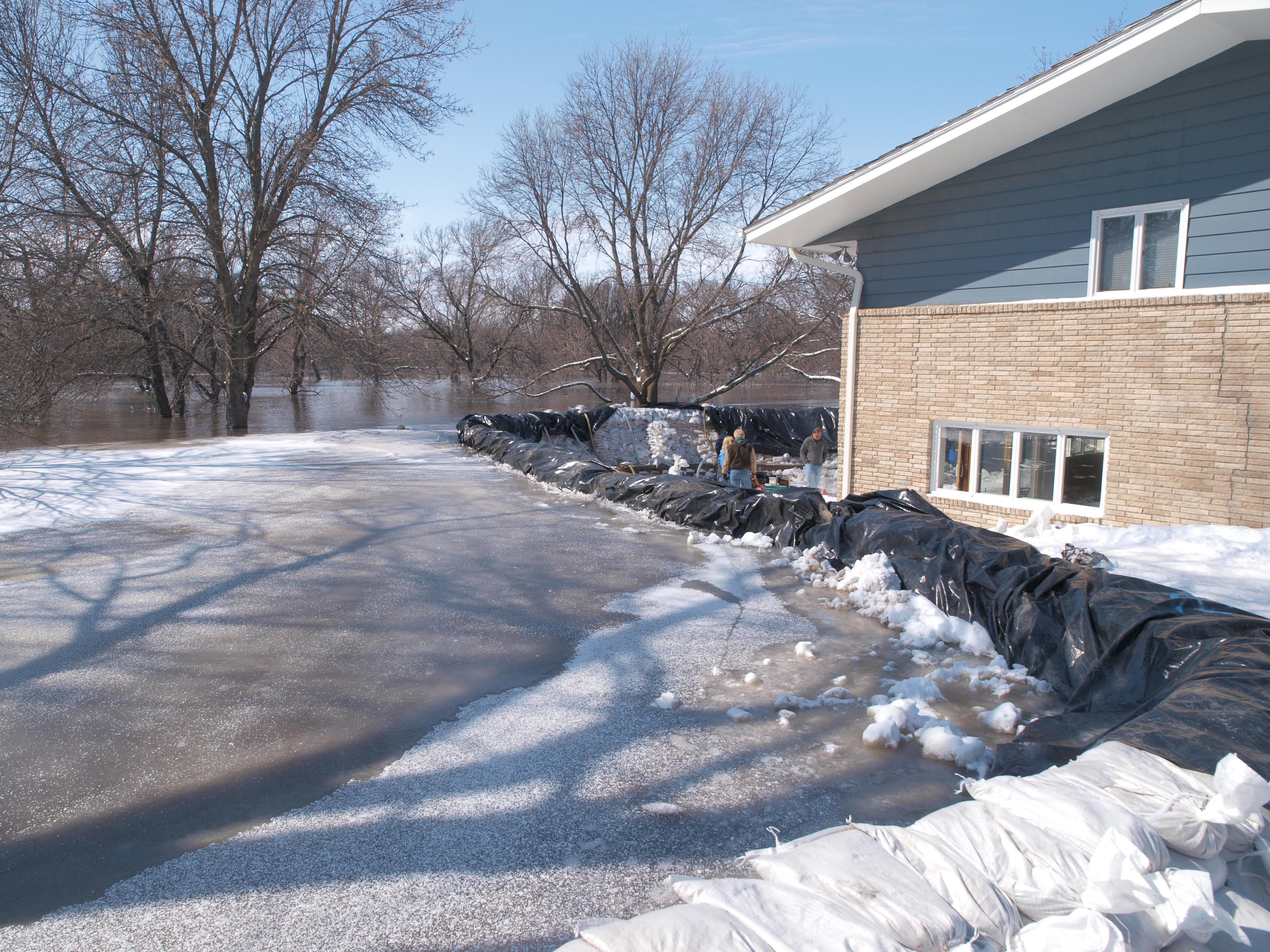 FEMA - 40352 - A home being protected by sand bags in Fargo, North Dakota.jpg