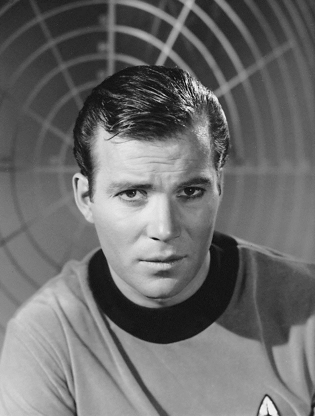 Publicity shot of William Shatner as Captain Kirk, [Public domain], via Wikimedia Commons