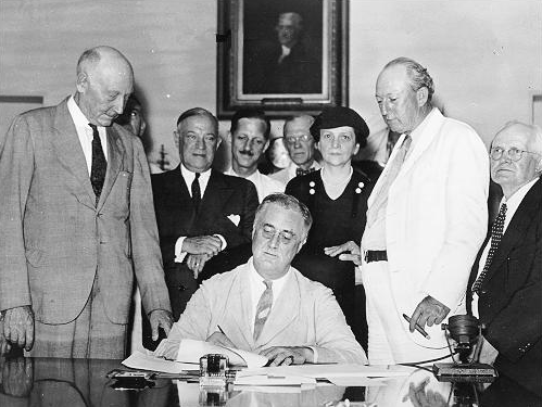 President Roosevelt Signs the Social Security Act, August 14, 1935.