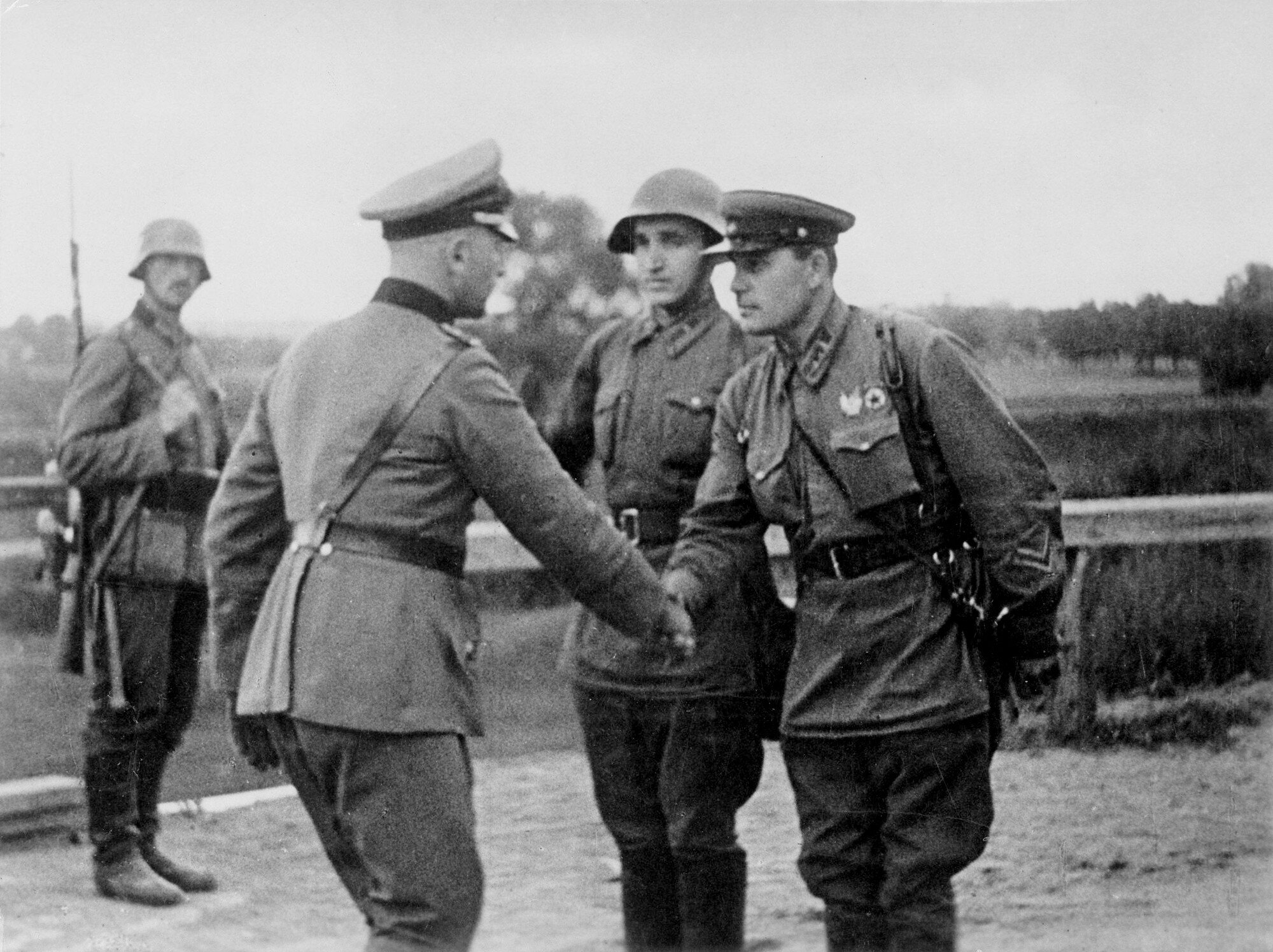 WIKI - A German and a Soviet officer shaking hands at the end of the Invasion of Poland.