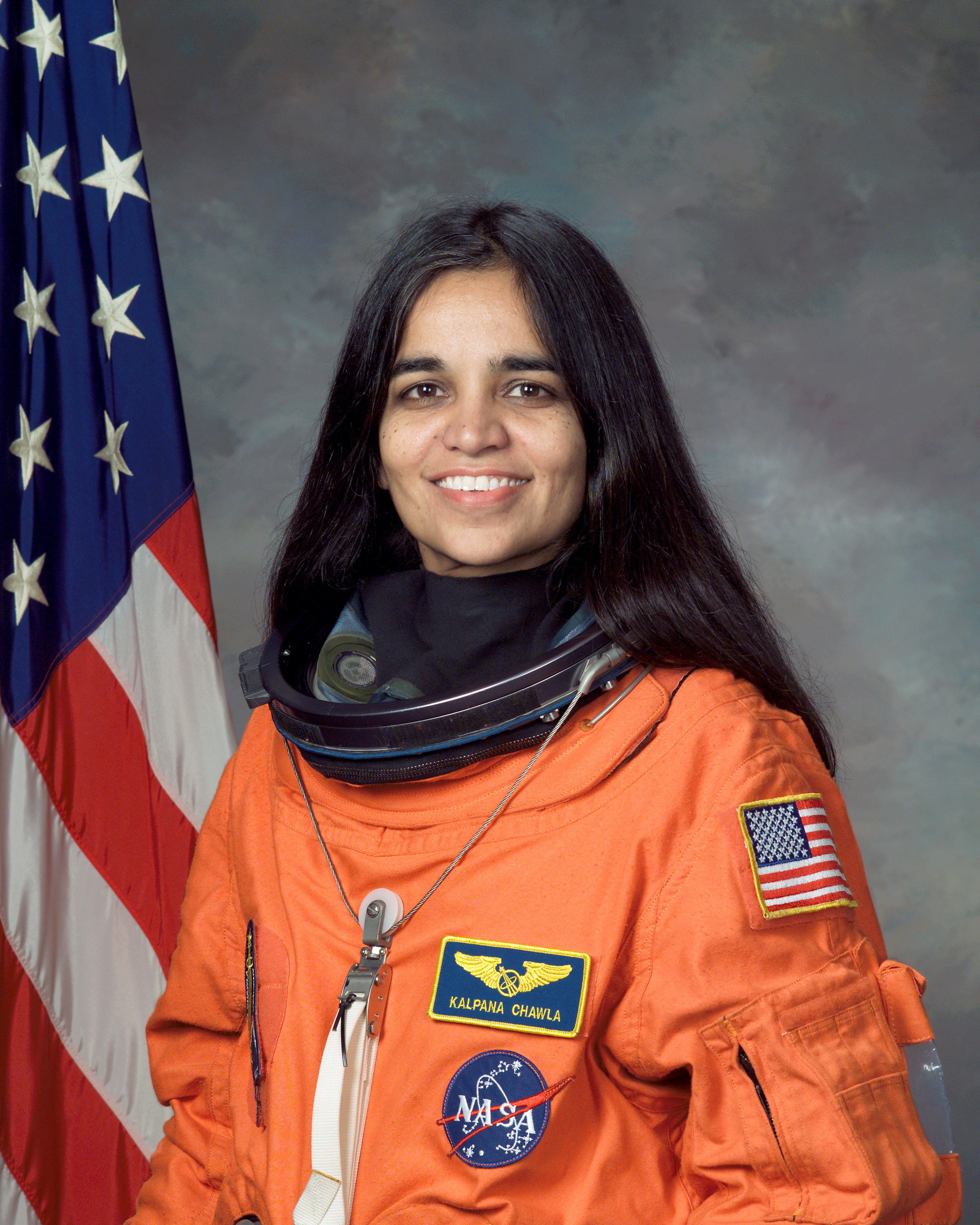 http://upload.wikimedia.org/wikipedia/commons/9/9c/Kalpana_Chawla,_NASA_photo_portrait_in_orange_suit.jpg