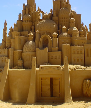 English: Intricate sand castle sculpture, appr...