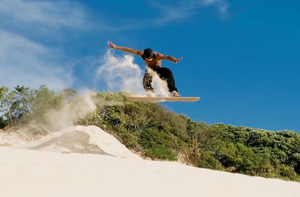 http://upload.wikimedia.org/wikipedia/commons/9/9f/Sandboarding.jpg