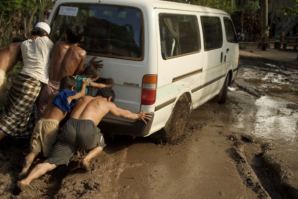 teamwork group activity van out of mud in cambodia