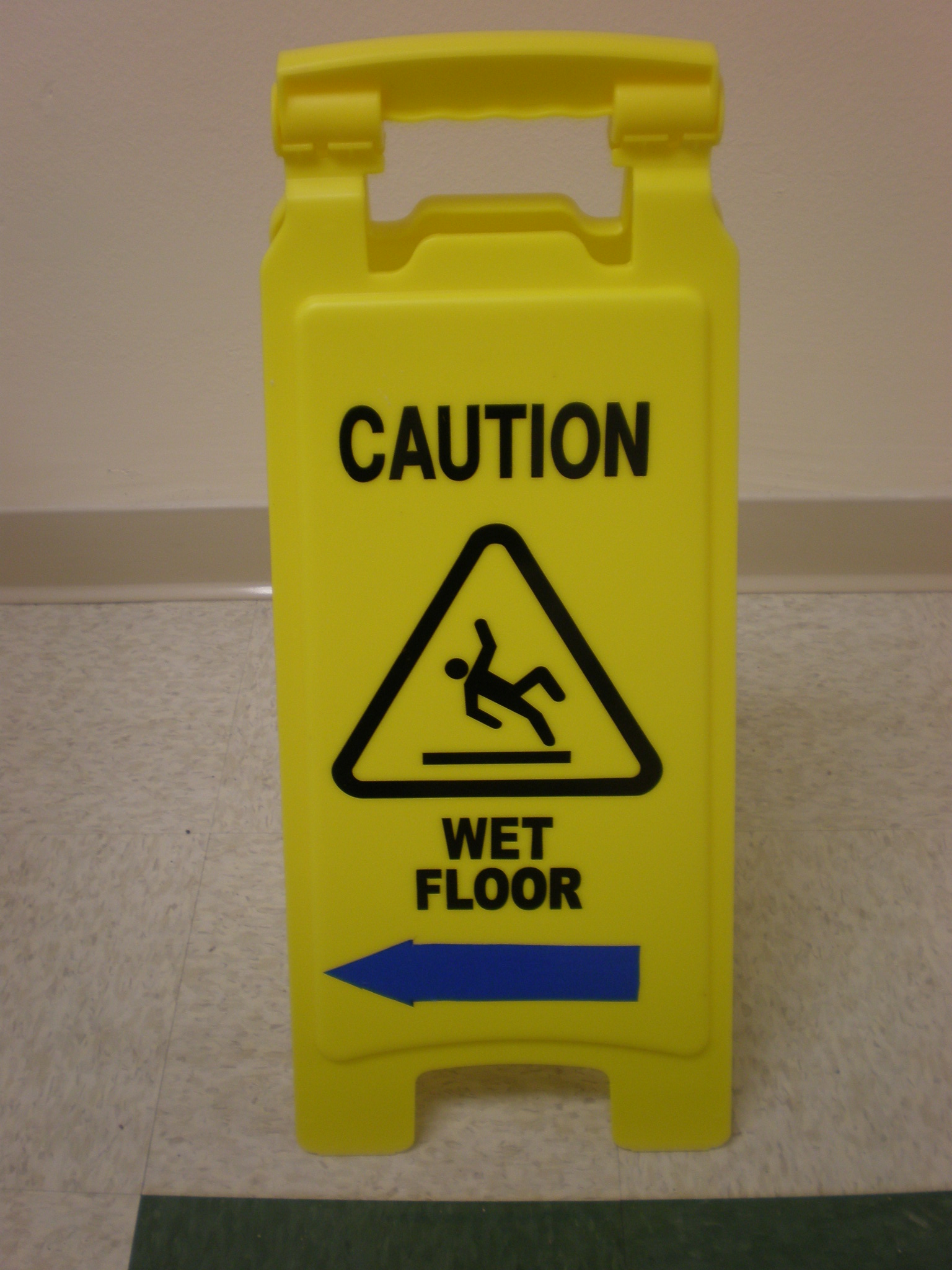 File:Yellow wet floor caution sign in English.JPG - Wikimedia Commons