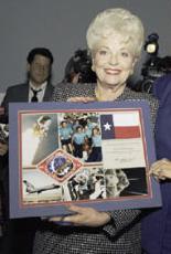 Texas Governor Ann Richards holds plaque of ST...