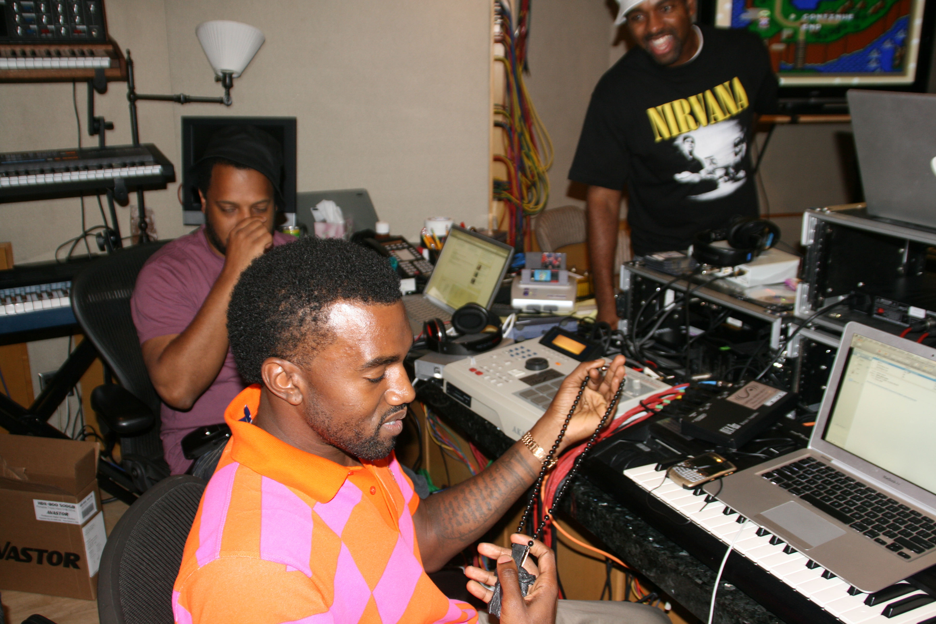 West working in the studio with his mentor No ID (left)