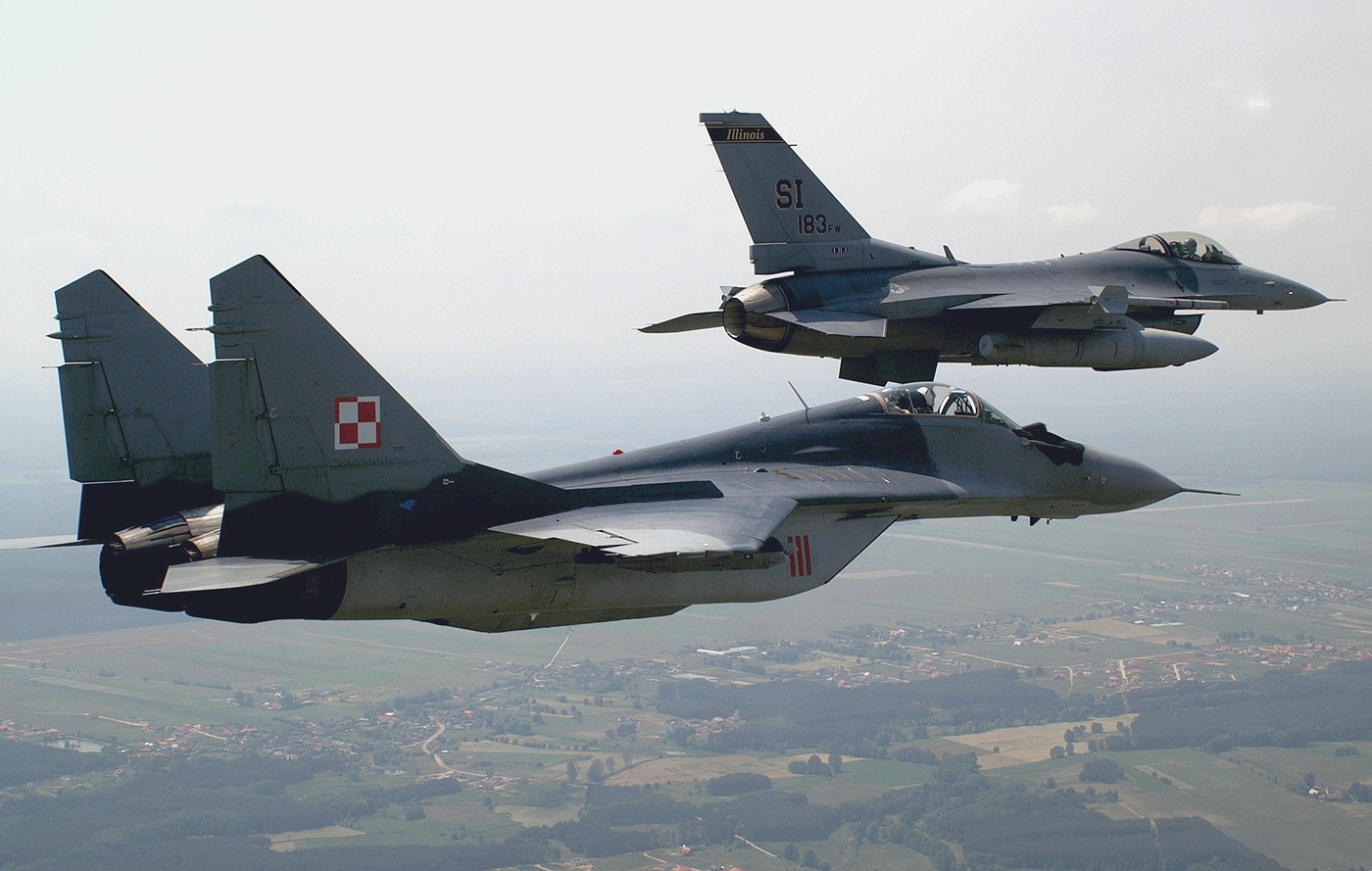http://upload.wikimedia.org/wikipedia/commons/a/ac/U.S._F-16C_Fighting_Falcon_and_Polish_Mikoyan-Gurevich_MiG-29A_over_Krzesiny_air_base%2C_Poland_-_20050615.jpg