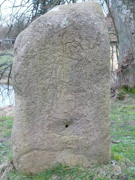 A rune-stone from Søvestad depicting a man carrying a cross, at Wikimedia Commons