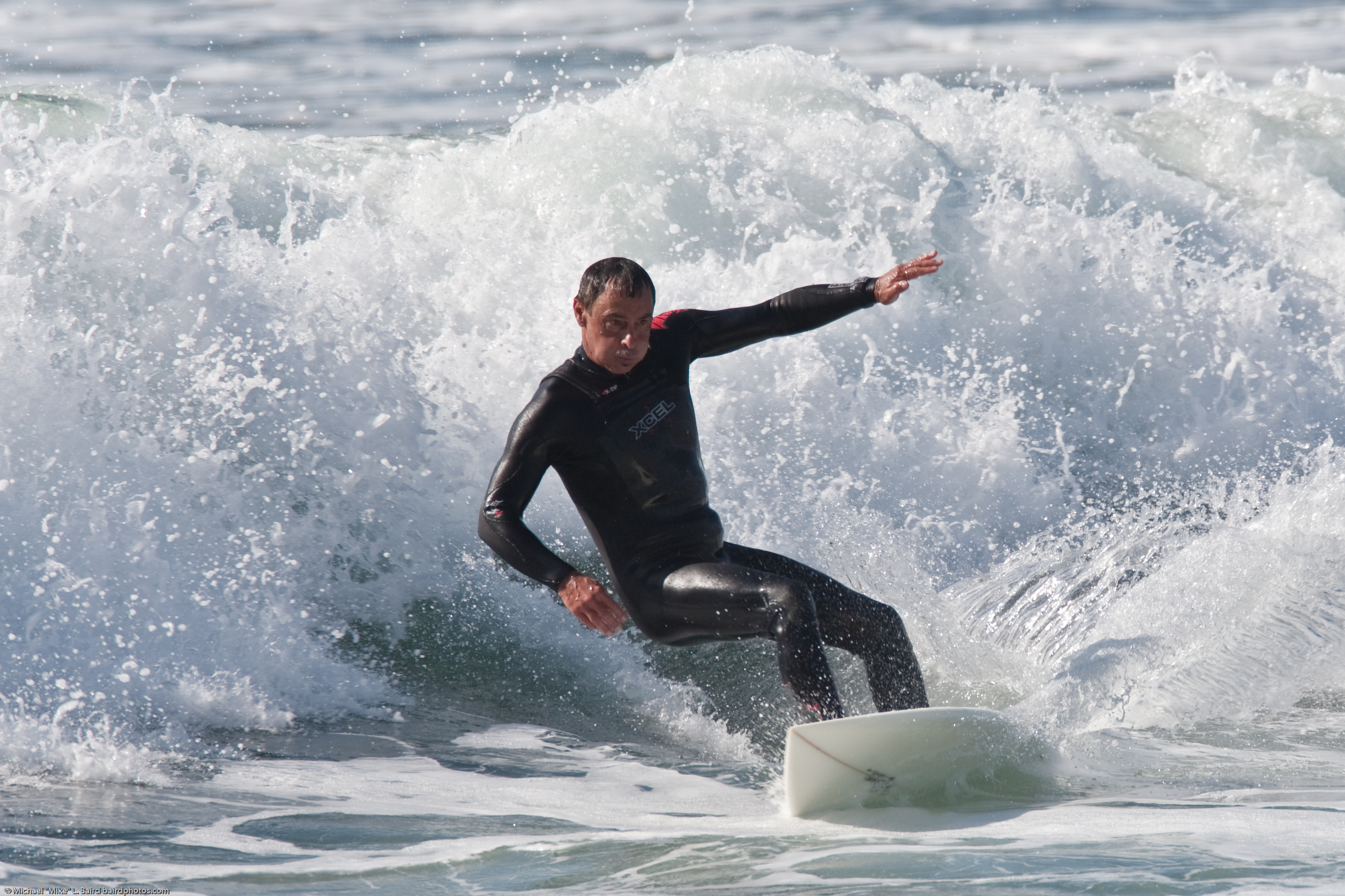 File:Mikebaird - Male Surfer Cuts a Good Form.jpg