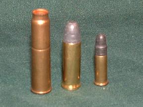 7.62×38R (7.62 Nagant) cartridge (left), shown next to a .32 S&W Long Cartridge and a .22 LR cartridge for comparison.