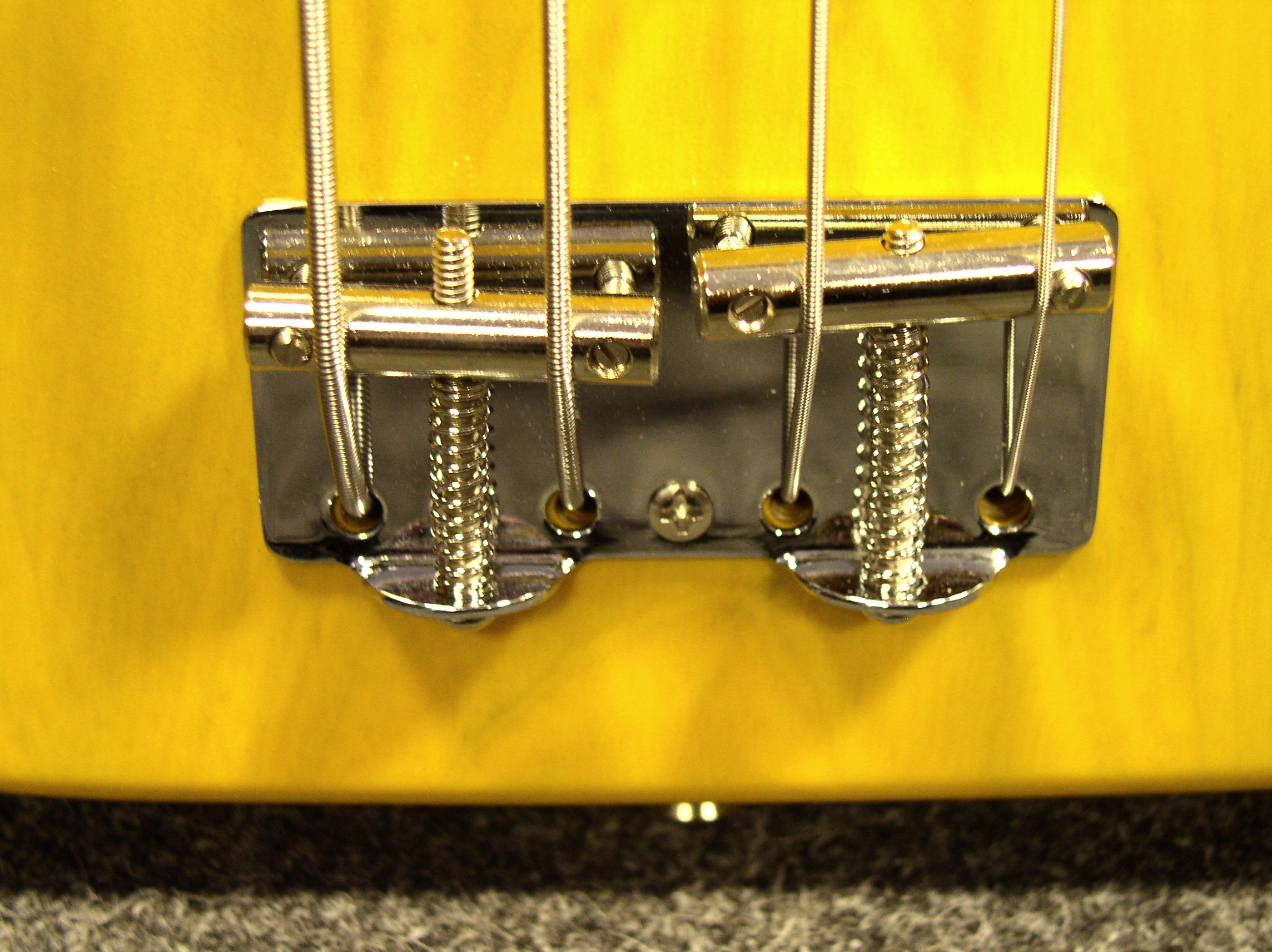 http://upload.wikimedia.org/wikipedia/commons/c/c5/Fender_51_Precision_Bass_Bridge.jpg